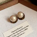 Leopard print round pearl stud earrings with hypoallergenic silver needle pins - Brown