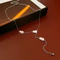 Elegant silver titanium steel necklace with pink zircon gourd pendants and tassel detail. - Style 31