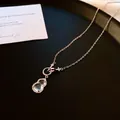 Elegant titanium steel necklace featuring a translucent double-layered gourd pendant - Style 7
