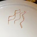 Close-up of rose gold wavy ear threads showing delicate diamond-cut details - Wave (12#)