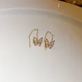 Elegant gold butterfly threader earrings with sparkling crystals on white ceramic - Butterfly (24#)