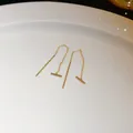 Close-up of minimalist 14k gold plated bar threader earrings on a white ceramic plate - Minimalist Bar (25#)