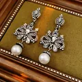 Elegant floral pearl dangle earrings with sparkling rhinestones in vintage jewelry box - Black-Silver