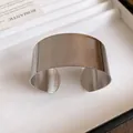 Macro view showing the fine ribbed texture of this wide stainless steel open cuff bracelet. - Horizontal Textured Style / Silver