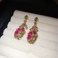 Vintage style pink floral glass tassel earrings in antique gold finish for elegant women. - Bronze-Pink
