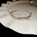 Elegant double-layer open gold bangle with pink heart stone and sparkling zircons - Style 43 / Gold-Pink