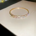 Elegant adjustable gold cross-over bangle with baguette zircons, French vintage style - Style 46 / Gold