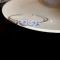 Exquisite silver open bangle decorated with heart-shaped zirconia and crystals - Style 49 / Silver