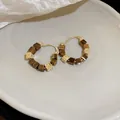Close-up of resin cube hoop earrings with vintage gold-tone accents and star motifs - 21# Hoop Earrings - Square Tiger Eye (Gold Plated)