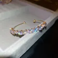 Elegant gold open-end bangle featuring sparkling lavender zircons in French retro style - Style 56 / Gold