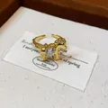 Close-up detail of a gold-plated pony open ring featuring a sparkling heart zircon center - Heart Zirconia Pony Style / Gold