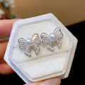 Elegant bowknot stud earrings with shimmering pearls and zircons on a white velvet box - Hollow Bow Style (4#) / Silver