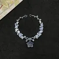 Handmade retro blue beaded flower bracelet with a star pendant on black textured background - Bowknot Pentagram Style (37#) / Blue / Star