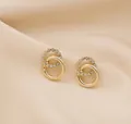 Elegant gold interlocking double ring stud earrings accented with sparkling rhinestones - Gold