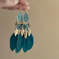 Exotic Bohemian teal feather earrings with gold leaf tassels and tribal pattern enamel - Gold Ear Hook / Blue
