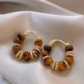 Detailed close-up of vintage golden hoop earrings with brown tiger eye stone beads - 23# Tiger Eye Beaded Gold Clip