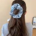 Oversized light blue pleated satin scrunchie hair accessory for elegant bun styling - Blue Satin