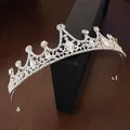 Close-up of elegant silver tiara with intricate rhinestone flower and waterdrop patterns. - Small Size / Silver