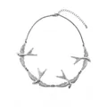 Elegant silver swallow bird necklace in vintage metal style for a minimalist fashion look. - Silver