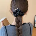 Elegant large black satin scrunchie hair accessory shown on a braided hairstyle. - Scrunchie (52#) / 9cm / Black