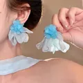 Elegant handcrafted blue fabric flower silver needle stud earrings worn by an Asian model - Blue (81# Silver Post-Blue)