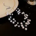 Close-up detail of multi-layer pearl necklace featuring elegant floating interlaced design - Multilayer Staggered Style / White