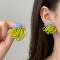 Vista dettagliata di orecchini a frangia con perline in nuovo stile cinese su modella - Stile Perno in Argento / Verde