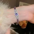 Elegante bracciale in argento stile vintage con zirconi viola e design a occhio ovale al polso - Bracciale Vintage Occhio e Fiore (58#) / Viola