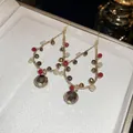 Eleganti orecchini a cerchio in stile New Chinese con perline rosse e bronzo - Stile a Gancio / Oro Bianco Rosso Champagne Caffè