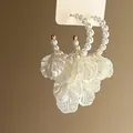 Elegant French style pearl hoop earrings with dangling white flower petals for women - Dangle Earrings / Pearl White