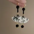 Close-up detail of elegant Chinese style fan earrings with bamboo pattern and black beads - Fan Style (HE19716) / Black/White