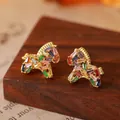 Exquisite close-up of gold horse stud earrings pavé-set with vibrant colorful gemstones - Gold Colorful Rhinestone Horse (15#)