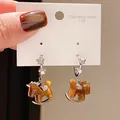 Close-up of rocking horse drop earrings featuring rhinestones and 316L stainless steel. - Silver Caramel Floral Style (10#)