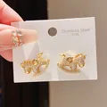 Detail view of gold rocking horse stud earrings encrusted with cubic zirconia on 316L steel - Gold Full Rhinestone Rocking Horse (11#)