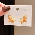 Close-up detail of unicorn stud earrings crafted in 316L stainless steel with orange crystals. - Gold Orange Crystal Style (16#)