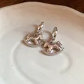 Detail view of silver hammered rocking horse earrings with pavé set crystals on rocker - Silver Ear Clip Rocking Horse (28#)