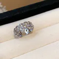 Close-up detail of silver-toned hollow flower lattice ring with cubic zirconia - Hollow Flower / Silver