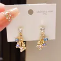 Close-up of elegant stainless steel earrings with sparkling blue and yellow crystals - Gold Colorful Clustered Style (38#)