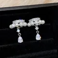Macro view of French style pearl ear clips with sparkling zircon waterdrop pendants - Ear Clip (Pair) / Silver