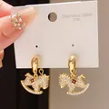 Elegant gold-plated rocking horse stud earrings with crystals and a small red flower. - Gold Full Rhinestone Red Flower (54#)