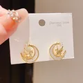 Gold-plated stainless steel stud earrings featuring a Pegasus and crescent moon design. - Gold Hollow Moon Horse (56#)