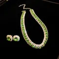 Close-up of emerald green jewelry set with necklace and earrings on black background - Necklace + Earrings / Silver-Green
