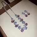 Detailed view of elegant pink zircon flower necklace and stud earring jewelry set - Necklace and Earrings Set / Pink