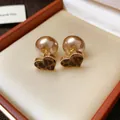 Close-up of heart-shaped leopard print earrings with elegant champagne pearl backs - Flocked Heart Style (HE29818) / Leopard Print