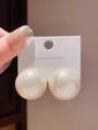 Detailed view of elegant oval pearl earrings with premium gold-plated S925 silver needles - Round (8#) / White