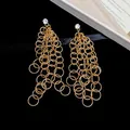 Elegant gold tassel earrings with interlocking hollow round rings and crystal inlay - Rhinestone Circle Tassel (40#) / Gold