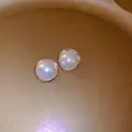 Elegant French retro style round pearl stud earrings with gold trim on golden tray texture - Round Bordered Pearl Studs (16# Silver Post)