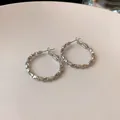 Elegant textured silver-tone hoop earrings featuring a unique minimalist light luxury design - Hammered Process Style (HE8275-21) / Silver