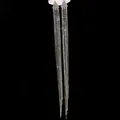 Close-up detail of sparkling long tassel rhinestone earrings against a dark background - Silver Pin Long Tassel Style / Silver