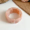 Detailed close-up showing the marbled texture of a pink acrylic rectangular elastic bangle - Pink